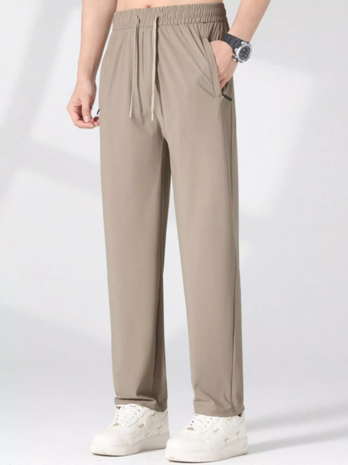 Plus size men's casual lightweight quick-dry pants by Trendsi, shown in a relaxed fit with a smooth fabric finish.