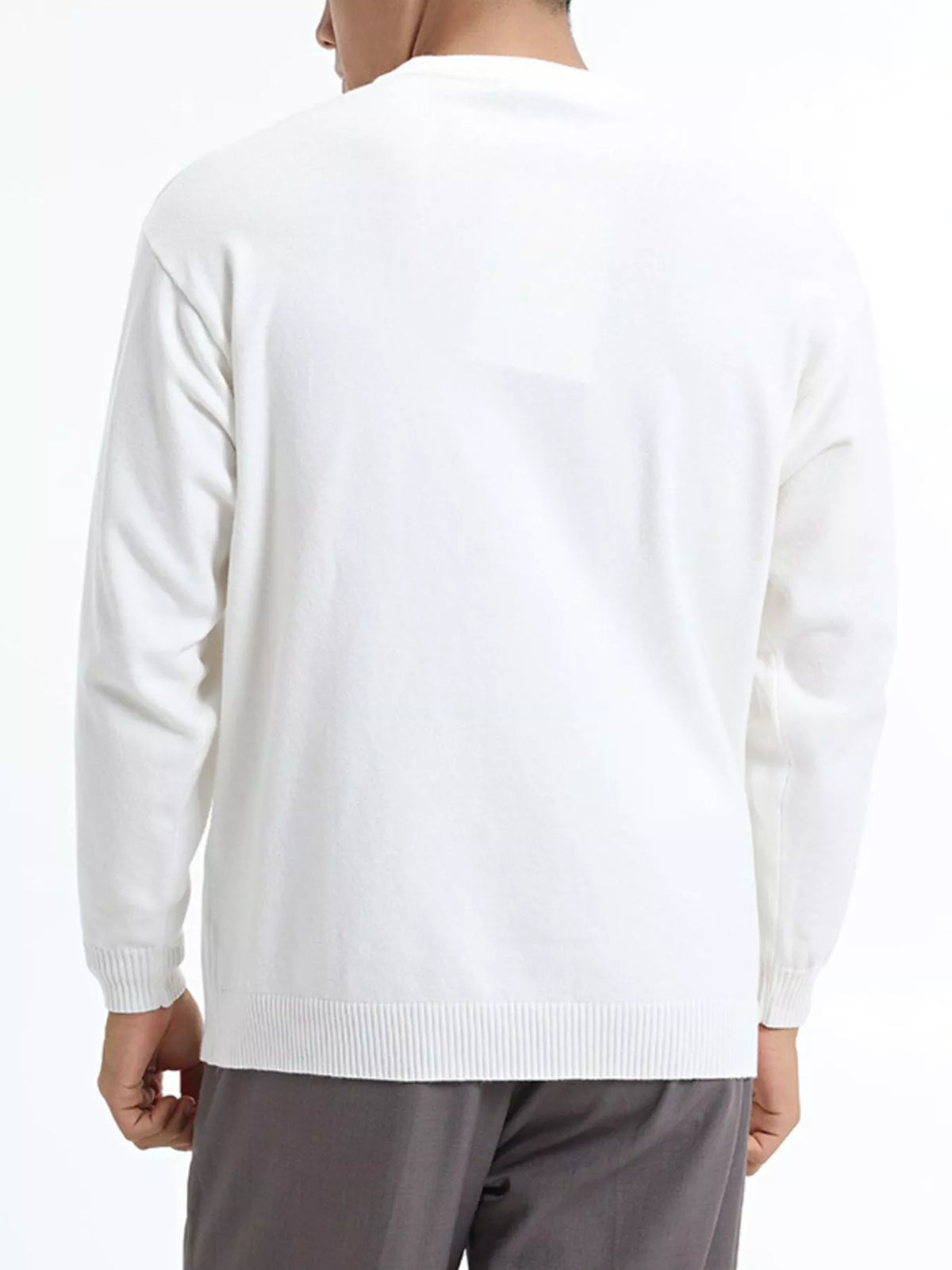 Men's minimalist crew neck sweater with ribbed cuffs from Trendsi, featuring a clean design and soft fabric in the image.