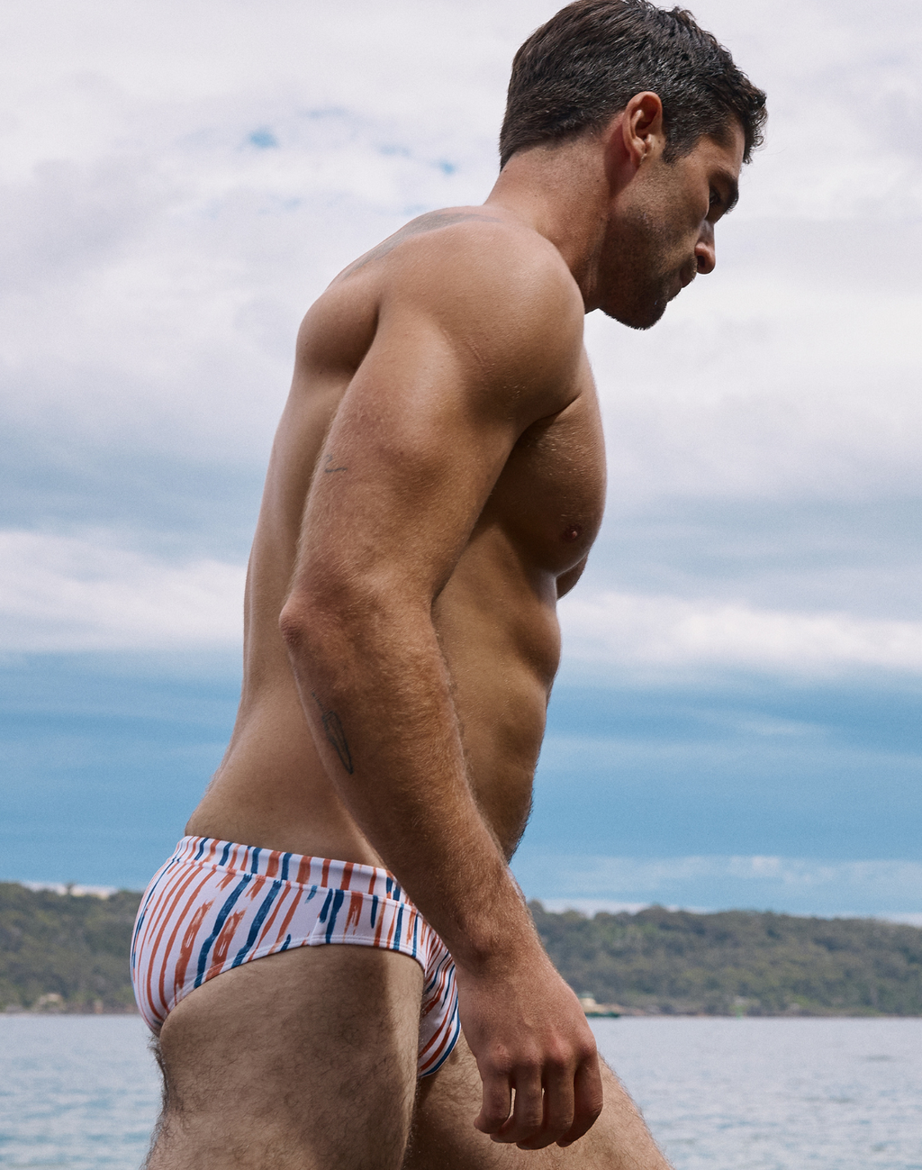 CityBOYZ USA 2Eros Oceanus men's swim brief featuring quick-dry fabric, vibrant blue and green ocean-inspired pattern, fitted design.