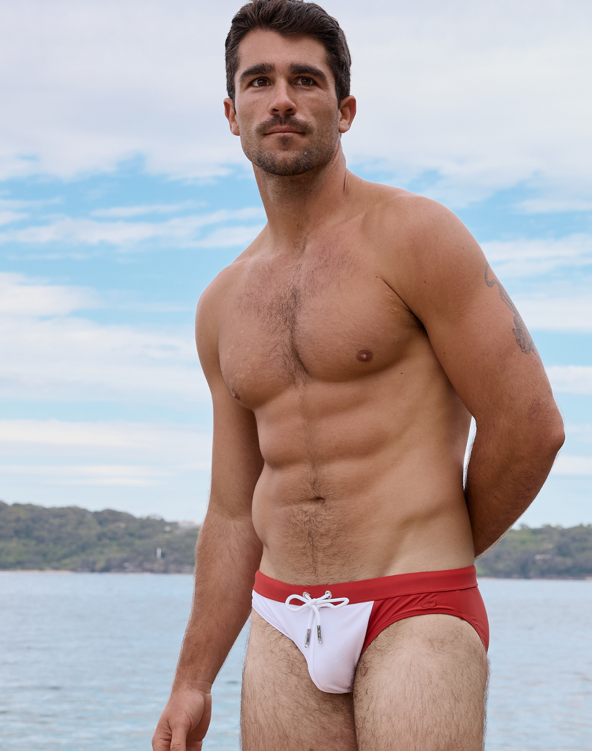 CityBoYZ USA 2Eros color blocked swim brief showing vibrant blue, red, and black panels, designed for stylish men's swimwear.