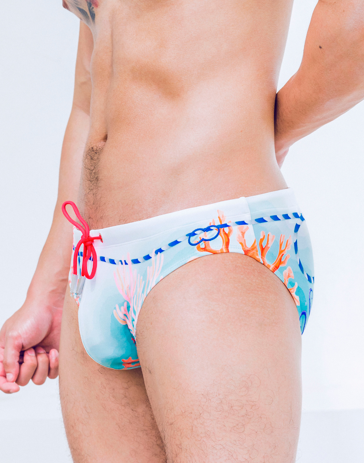 CityBoyz USA 2Eros Coralscape swim brief with vibrant coral pattern, snug fit, and lightweight fabric for comfortable swimwear.