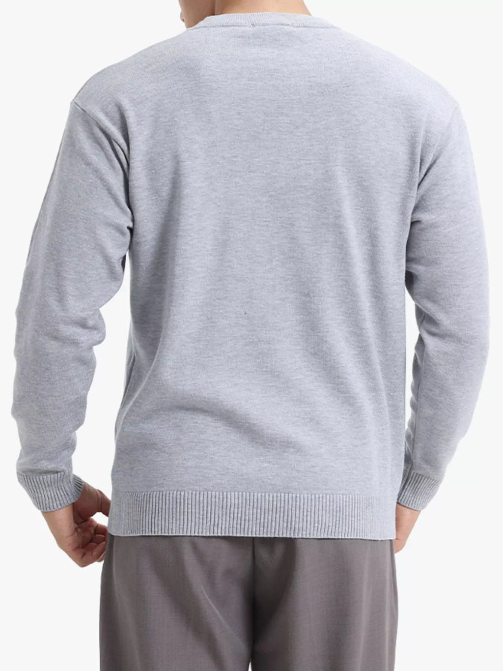 Men's minimalist crew neck sweater with ribbed cuffs from Trendsi, featuring a simple, clean design in neutral fabric.