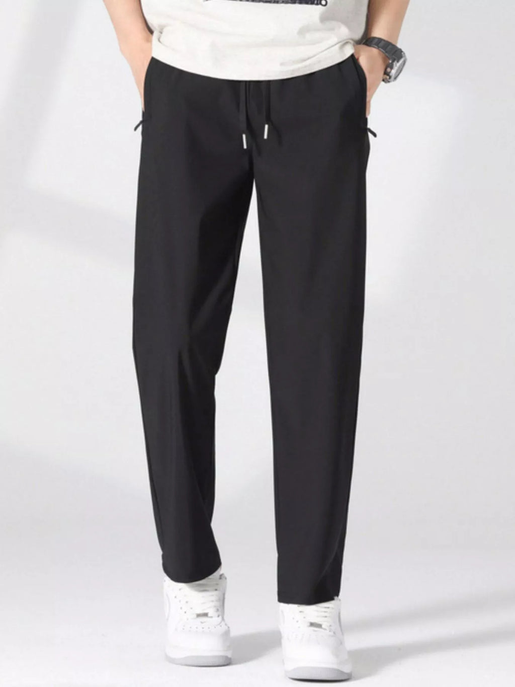 Plus size men's casual lightweight quick-dry pants by Trendsi, shown in a relaxed fit with smooth fabric and functional pockets.