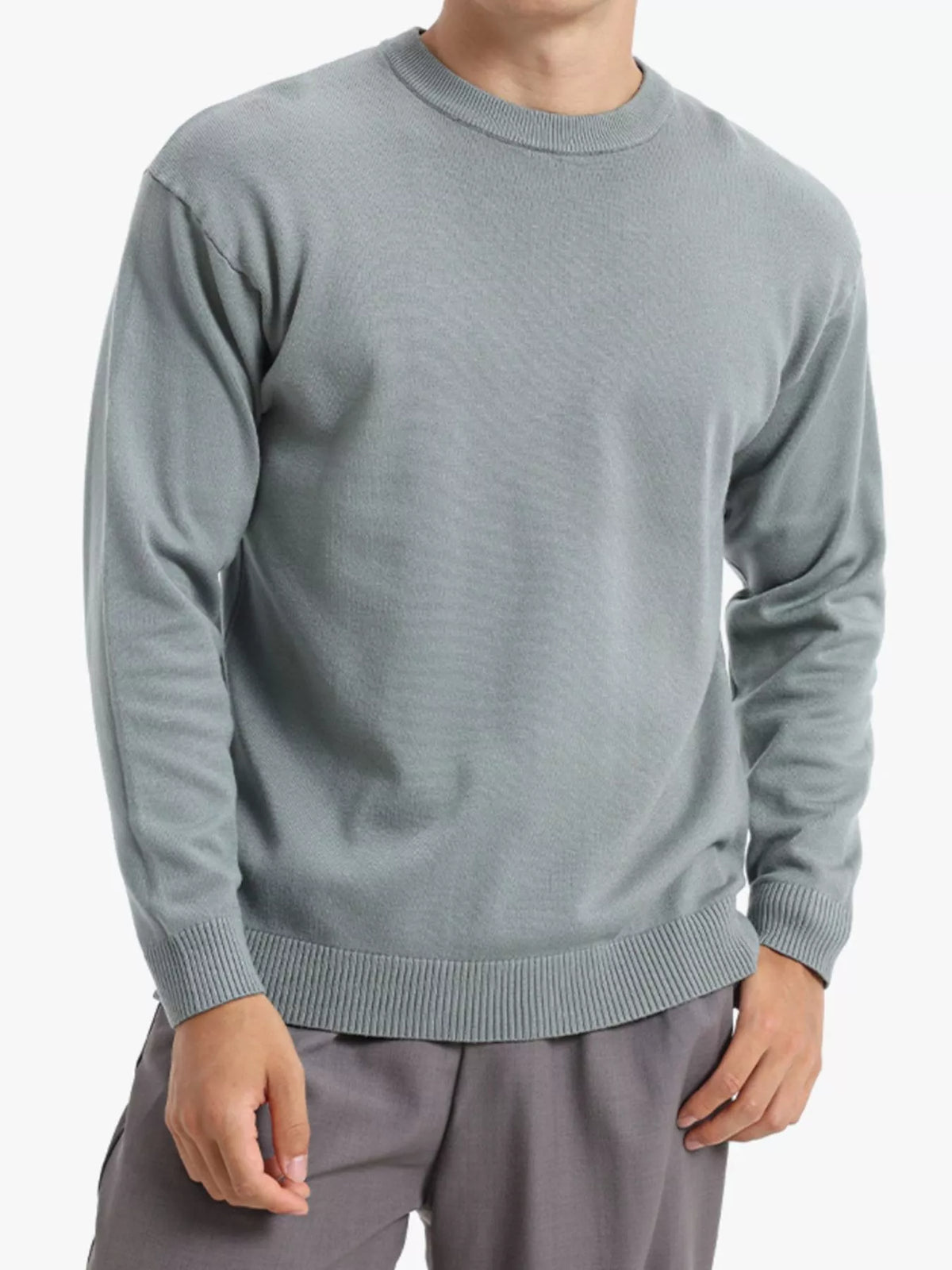 Men's minimalist crew neck sweater with ribbed cuffs by Trendsi, featuring a simple, stylish design in soft knit fabric.