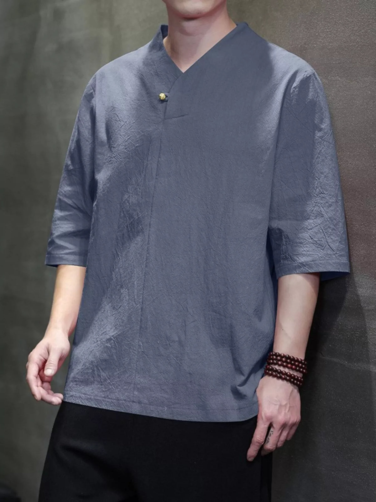 Nobilityze men's plus size solid color 3/4 sleeve shirt by Trendsi, displayed in a relaxed fit with a classic collar and cuffs.