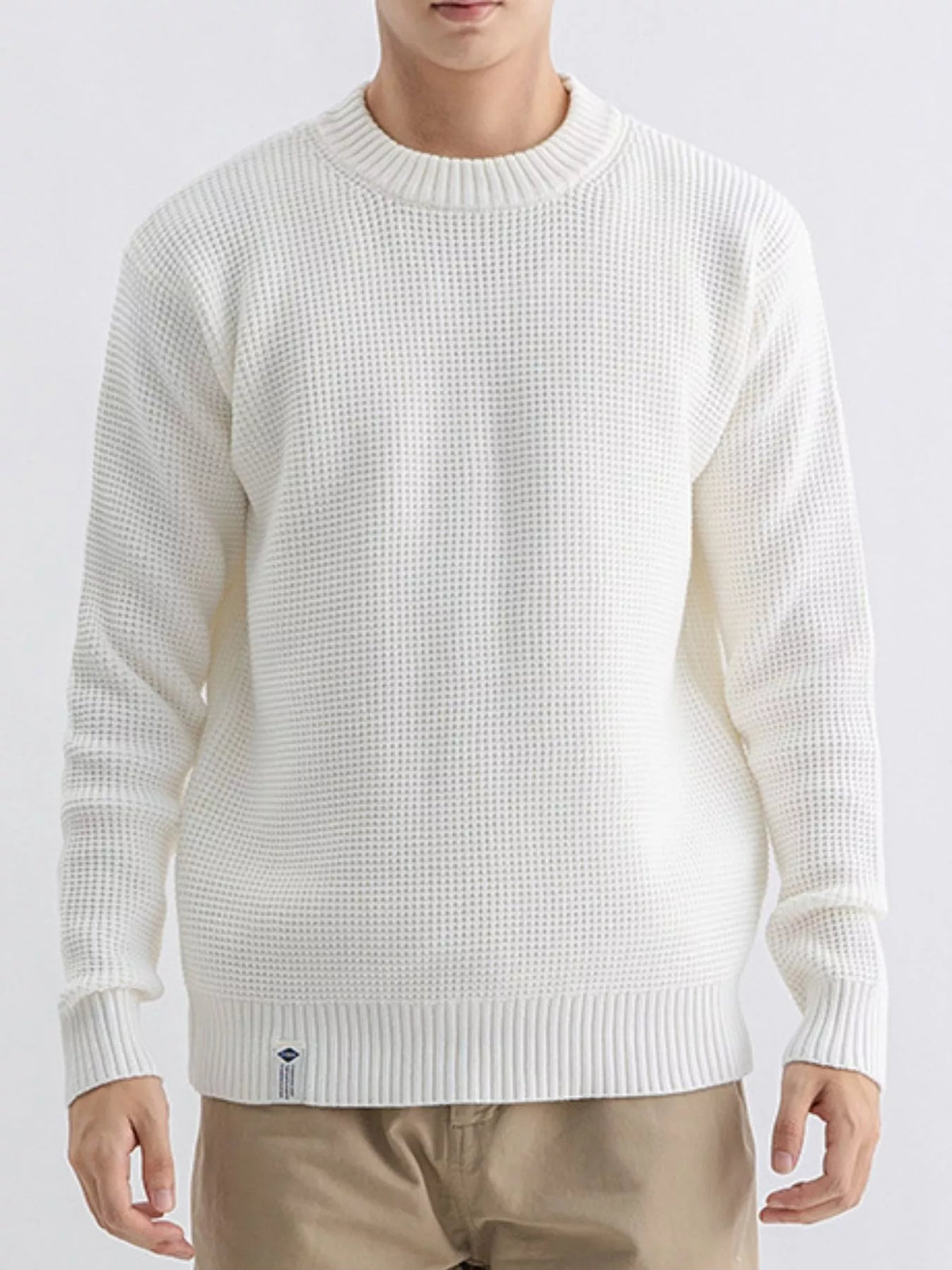 Plus size men's waffle knit crew neck sweater by Trendsi, featuring a textured fabric and classic fit in a cozy sweater style.