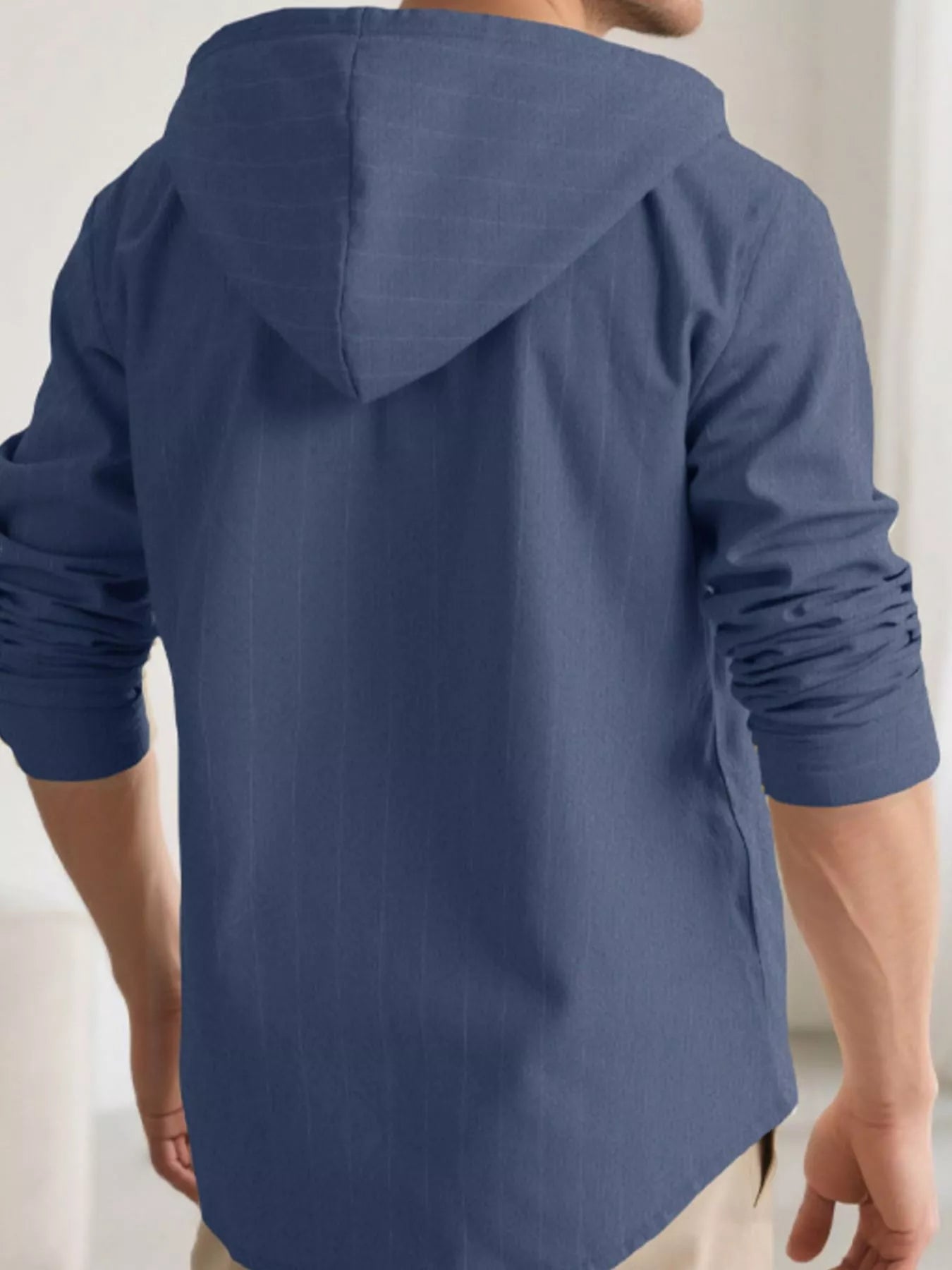 Plus size men's drawstring hooded button-up shirt from Trendsi, featuring a casual design with a hood and front button closure.