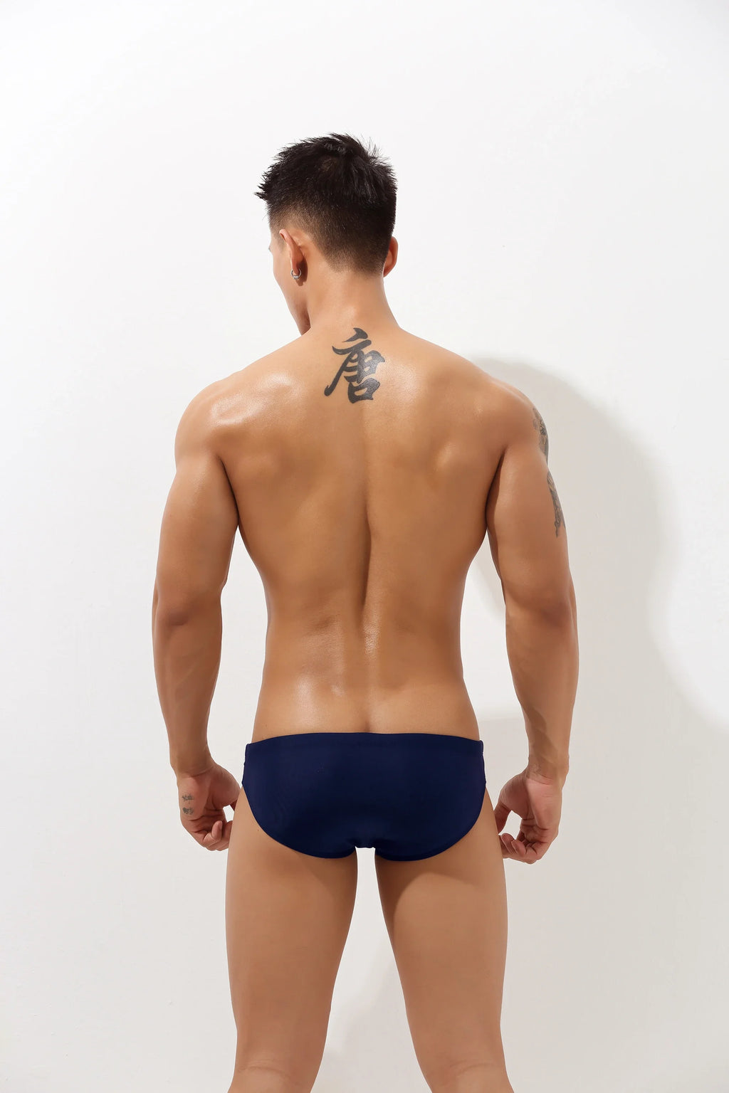 4inme low-rise cutout swim brief featuring a sleek design and cutout details, perfect for stylish beachwear or poolside lounging.