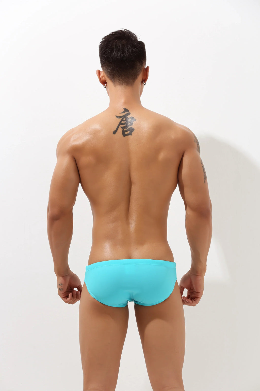 4inme low-rise cutout swim brief featuring sleek design and cutout details, perfect for stylish beachwear or poolside lounging.