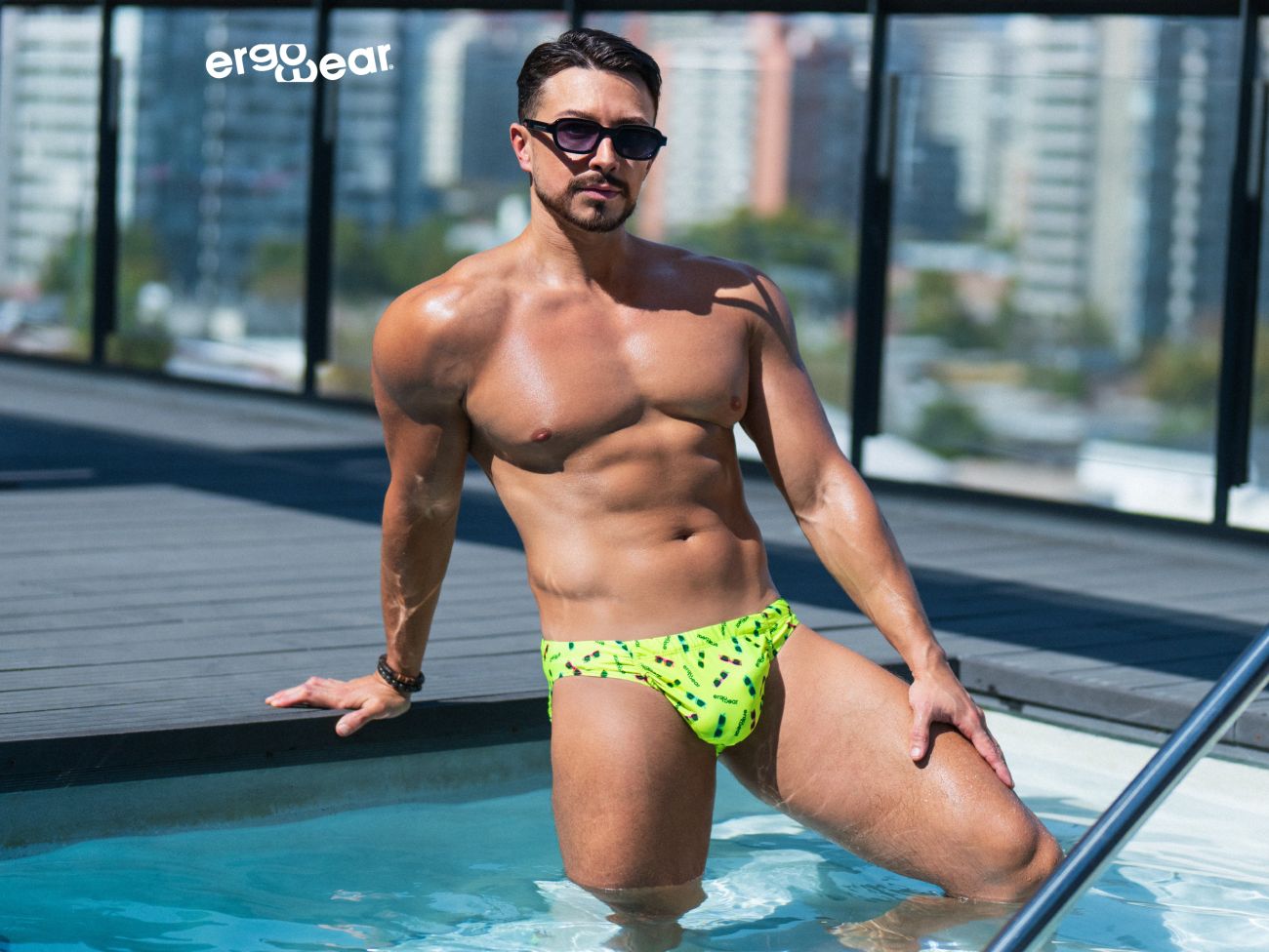 Bright yellow ErgoWear Feel SW swim brief by CITYBOYZ★USA, showcasing a stylish, comfortable swimwear design on a model.