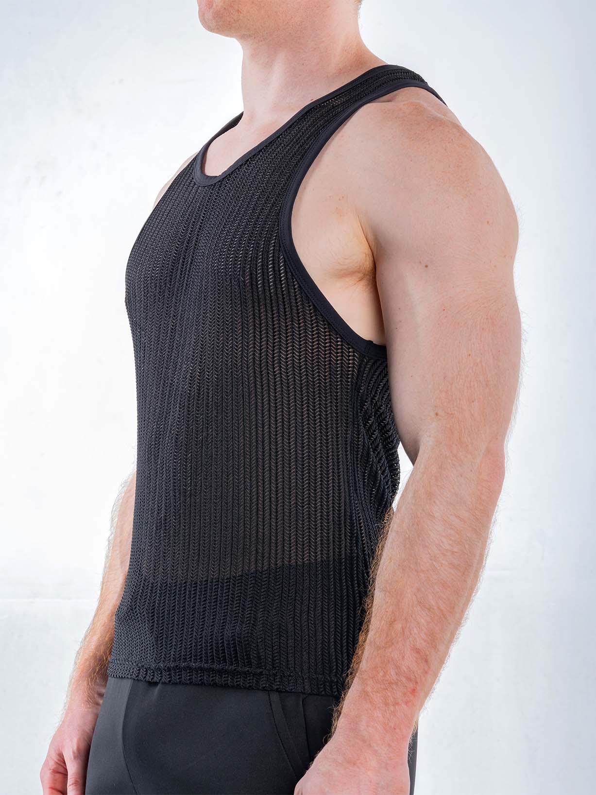 Black FK Sport Captivity mesh tank top by CITYBOYZ★USA shown from the side, featuring breathable fabric and athletic fit.