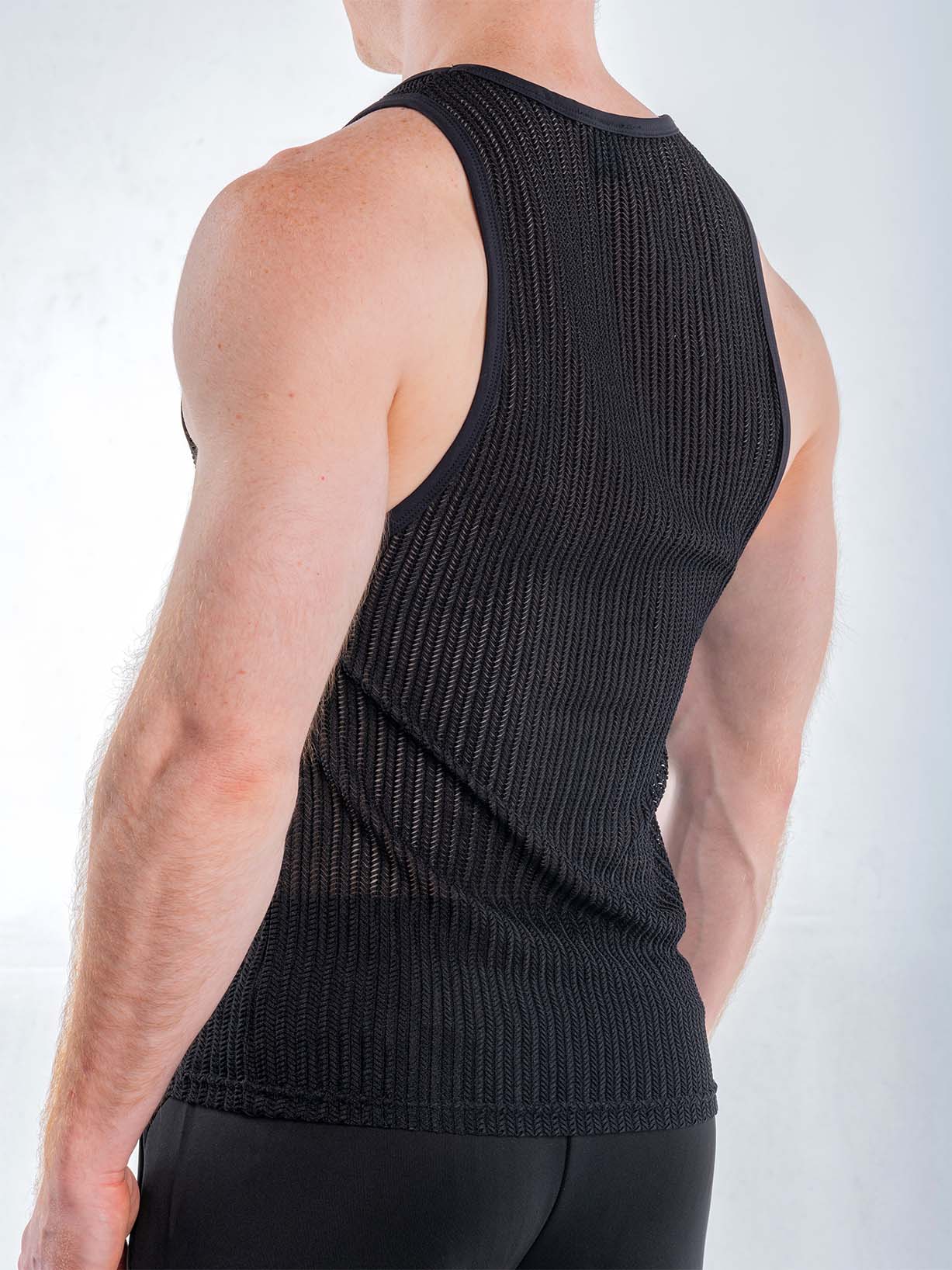Black FK Sport Captivity Mesh Tank Top by CITYBOYZ★USA, shown from the side with breathable mesh fabric and athletic fit.