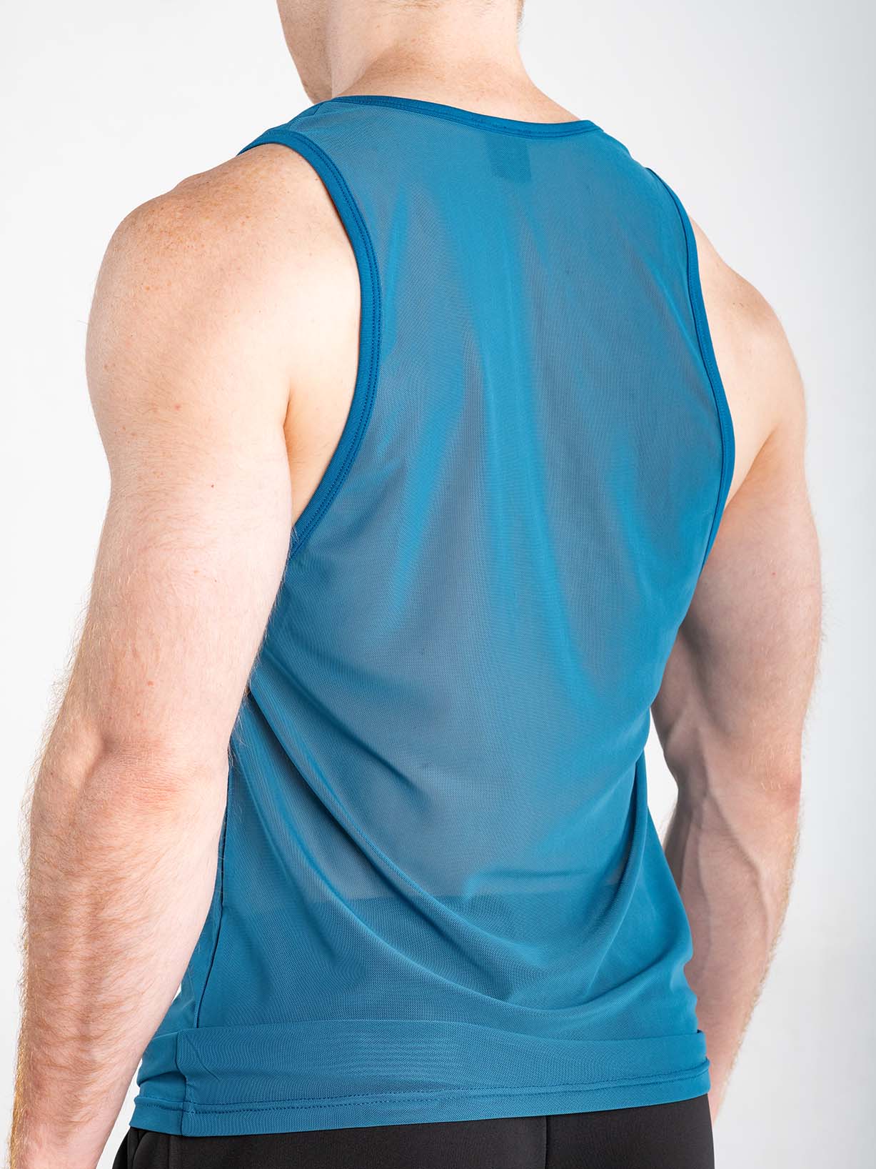Blue FK Sport Echo Tank Top by CITYBOYZ★USA featuring sleeveless design and athletic fit on a model.