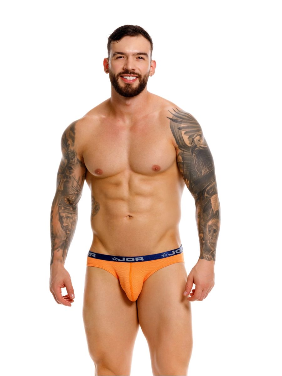 Orange CITYBOYZ★USA Jor Cannes Bikini Underwear with smooth fabric and minimal design, displayed on a flat surface.