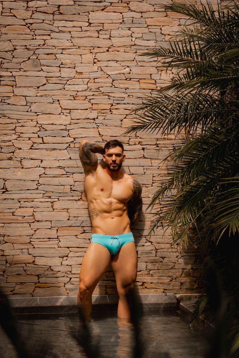 Men's turquoise neon swim brief by CITYBOYZ★USA, designed for active swimming and beachwear, featuring a sleek, fitted style.