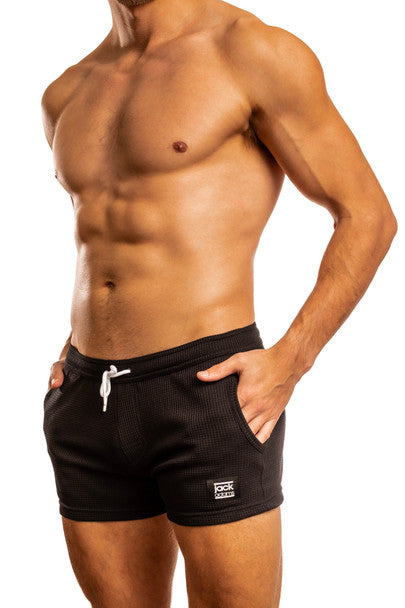 Black Jack Adams Waffle Squat 4" athletic shorts by CITYBOYZ★USA, shown from the side with a focus on the fit and fabric texture.