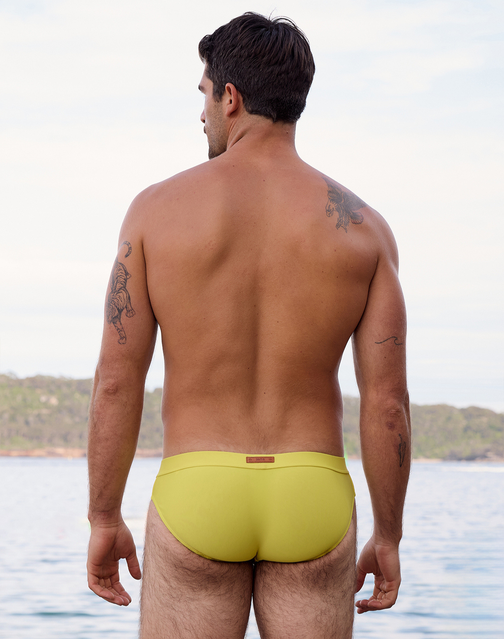 Neon yellow 2Eros Encore swim brief by CITYBOYZ★USA, showcasing a vibrant men's swimwear design on a white background.