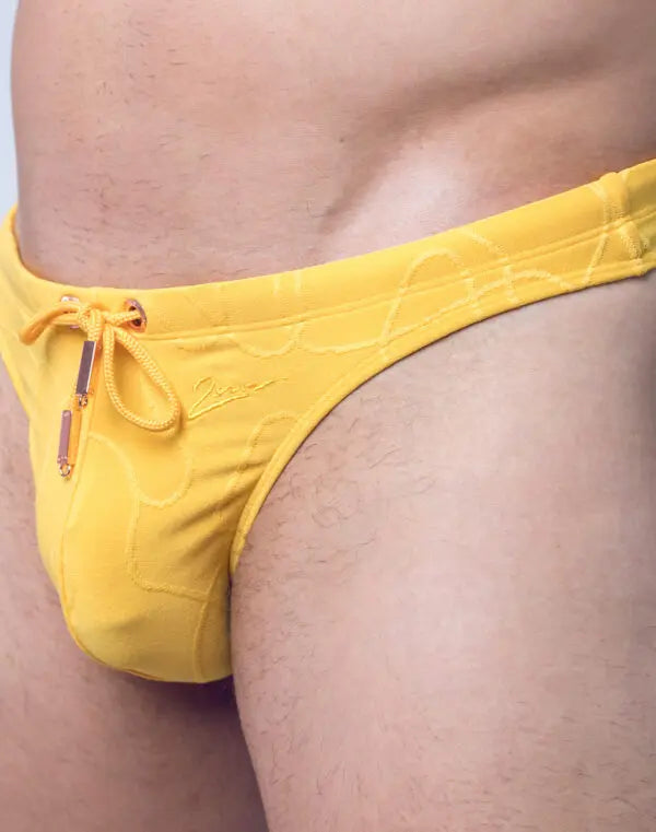 Yellow 2Eros Ripple Textured Swim Thong by CITYBOYZ★USA, showing the ripple pattern and slim design for swimming or beach wear.