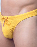 Yellow 2Eros Ripple Textured Swim Thong by CITYBOYZ★USA, showing the ripple pattern and slim design for swimming or beach wear.