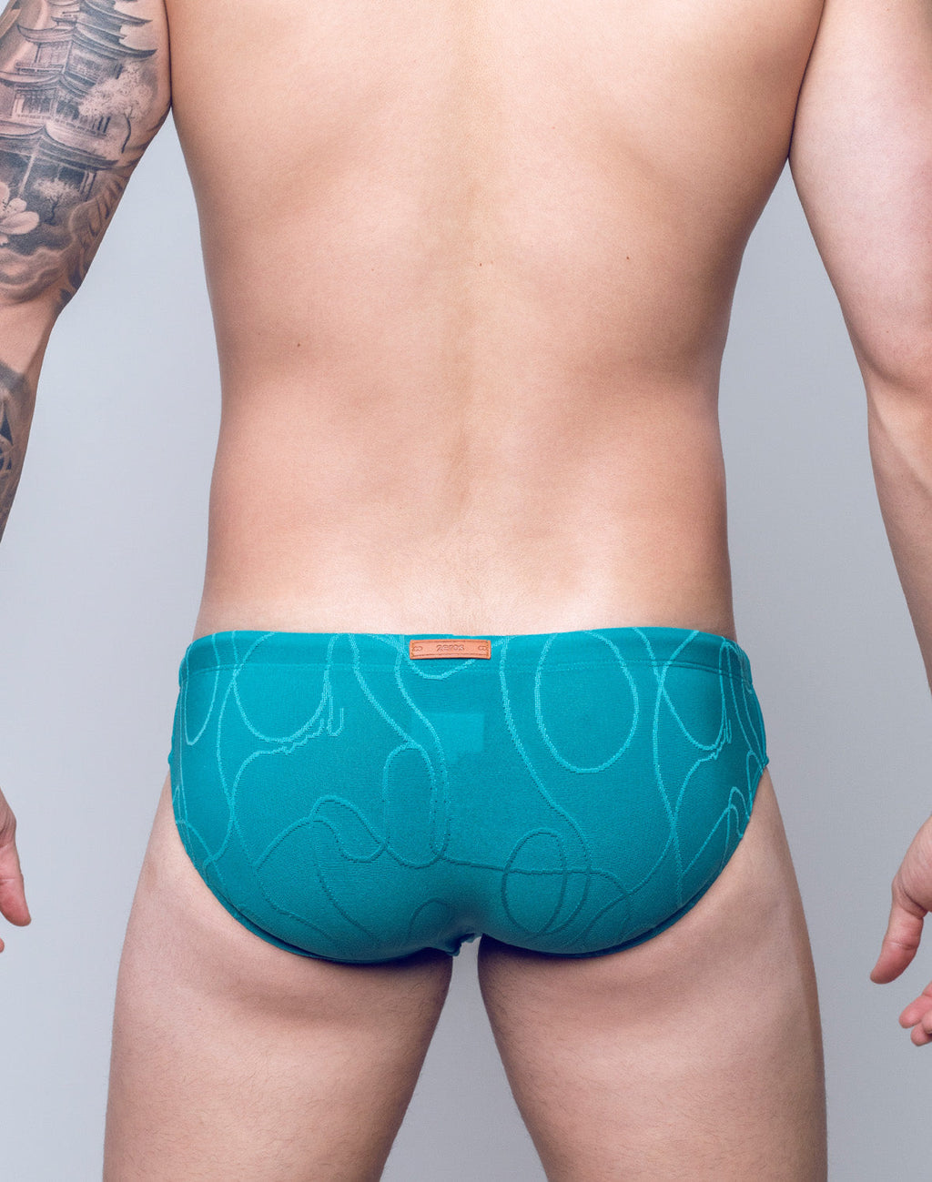 CITYBOYZ★USA 2Eros textured ripple swim brief in green, showcasing a sustainable swimwear design with a textured pattern.