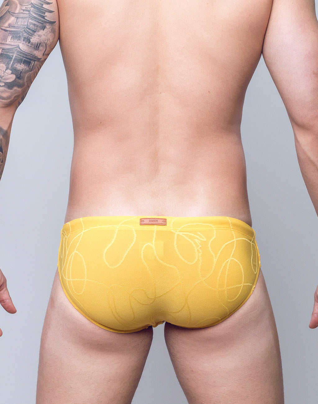 Yellow textured ripple swim brief by CITYBOYZ★USA, sustainable swimwear designed for comfort and style.