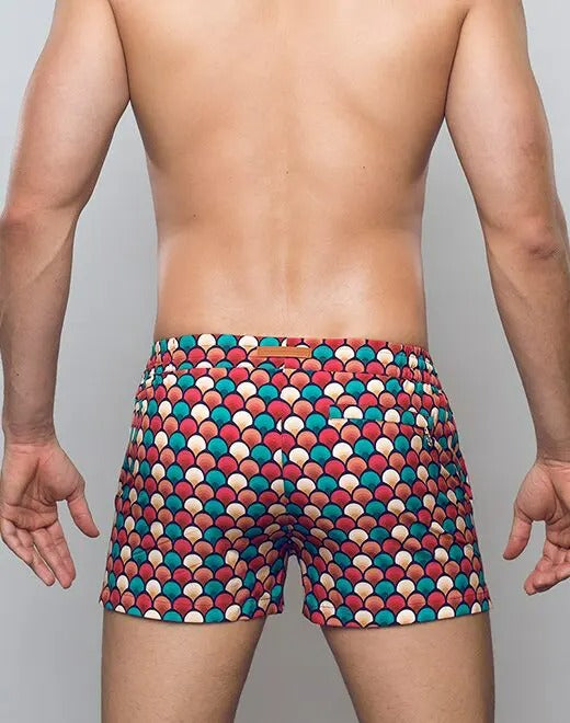 Red retro swim shorts by CITYBOYZ★USA featuring bold design, elastic waistband, and lightweight fabric for beach and pool wear.