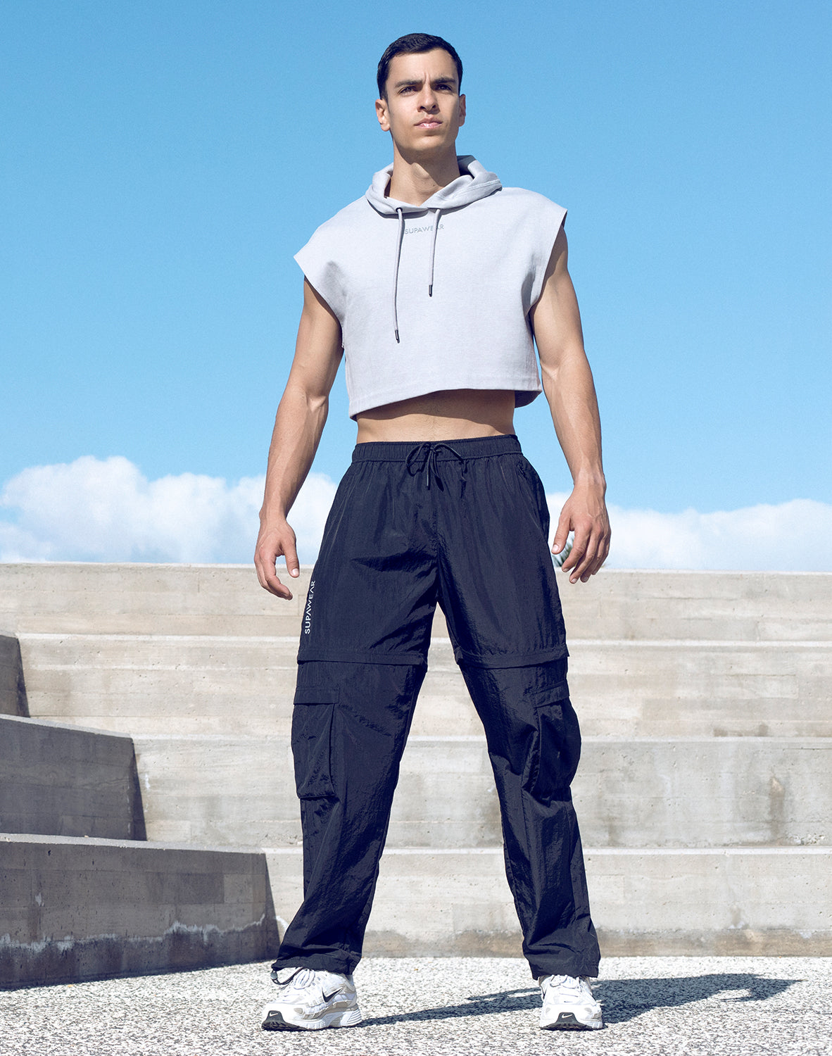 Gray Supawear cropped activewear hoodie by CITYBOYZ★USA, featuring a relaxed fit and stylish design with a hood and long sleeves.