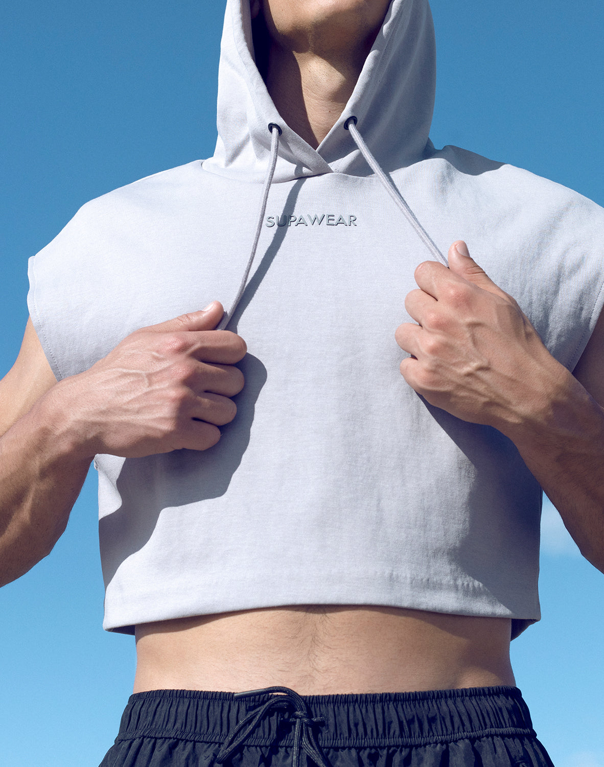 Grey Supawear cropped hoodie by CITYBOYZ★USA, activewear style with a relaxed fit and soft fabric, shown on a model.