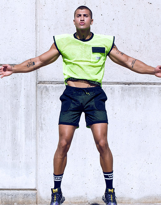 CITYBOYZ★USA Supawear neon mesh shirt, vibrant semi-sheer top with sleeveless design and sporty style, displayed on a hanger.