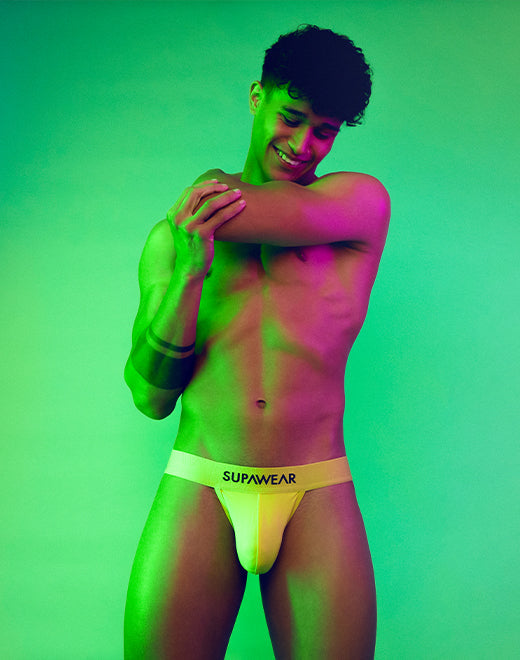 Bright neon Supawear Neon Jock underwear by CITYBOYZ★USA displayed on a model, showcasing its vibrant color and snug fit.
