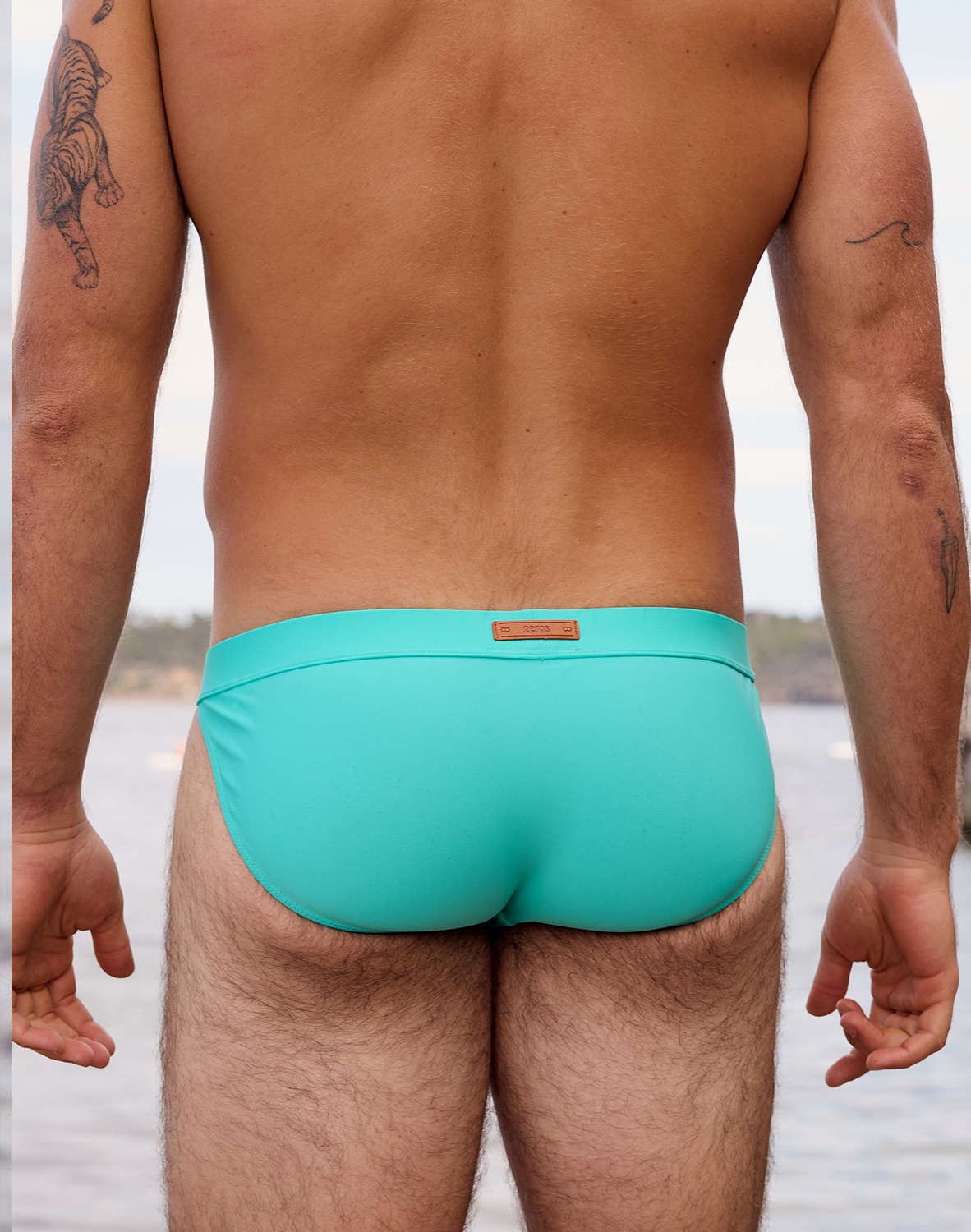 CityBOYZ USA 2Eros Encore Swim Tanga V50 in neon blue, featuring a sleek swim brief design for active water activities.