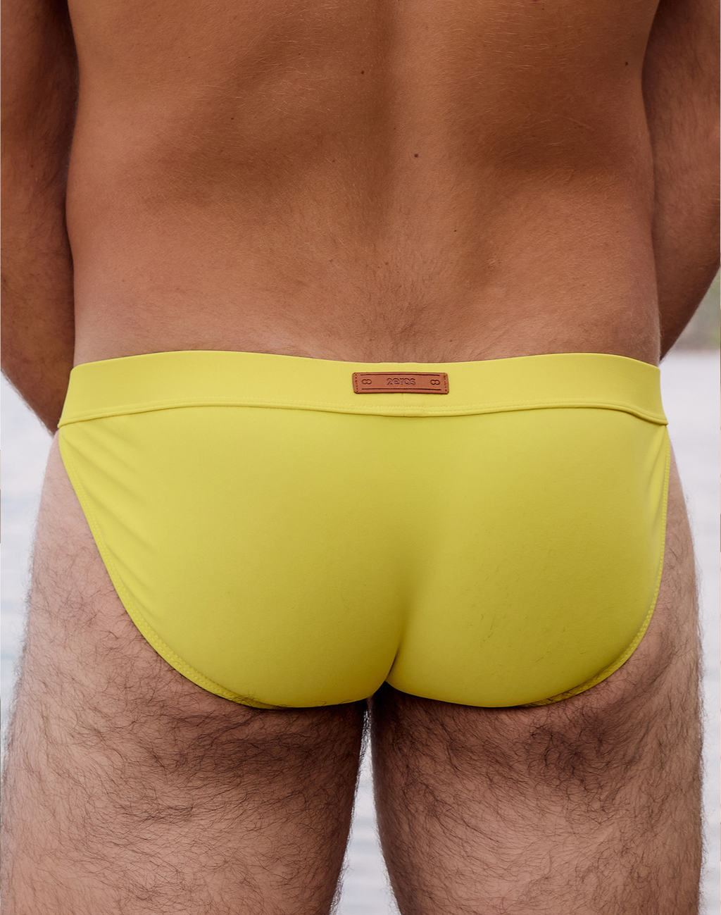 Bright neon yellow 2Eros Encore Swim Tanga V50 by CITYBOYZ USA, showcasing the sleek swim brief design and vibrant color.