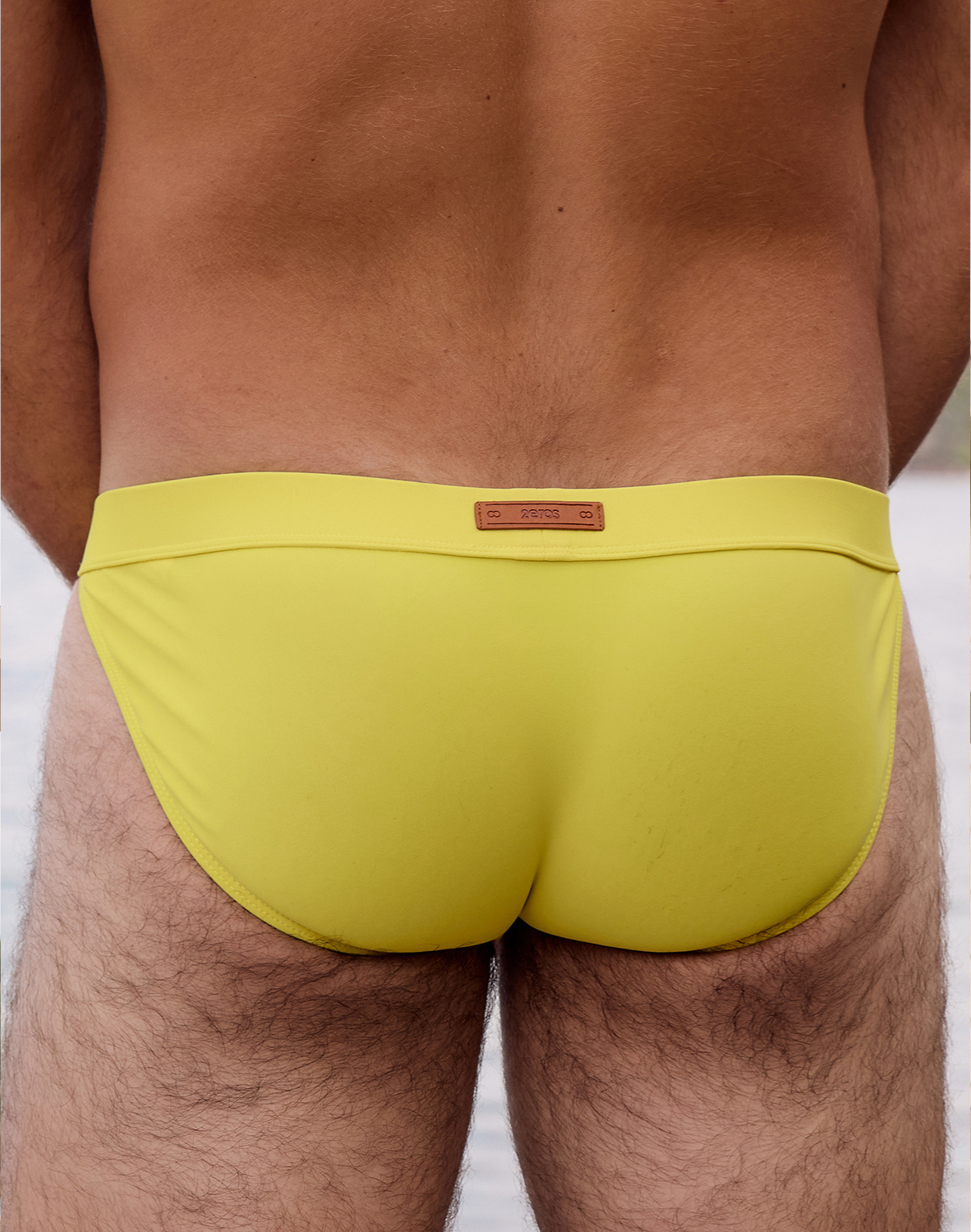 Bright neon yellow 2Eros Encore Swim Tanga V50 by CITYBOYZ USA, showcasing the sleek swim brief design and vibrant color.