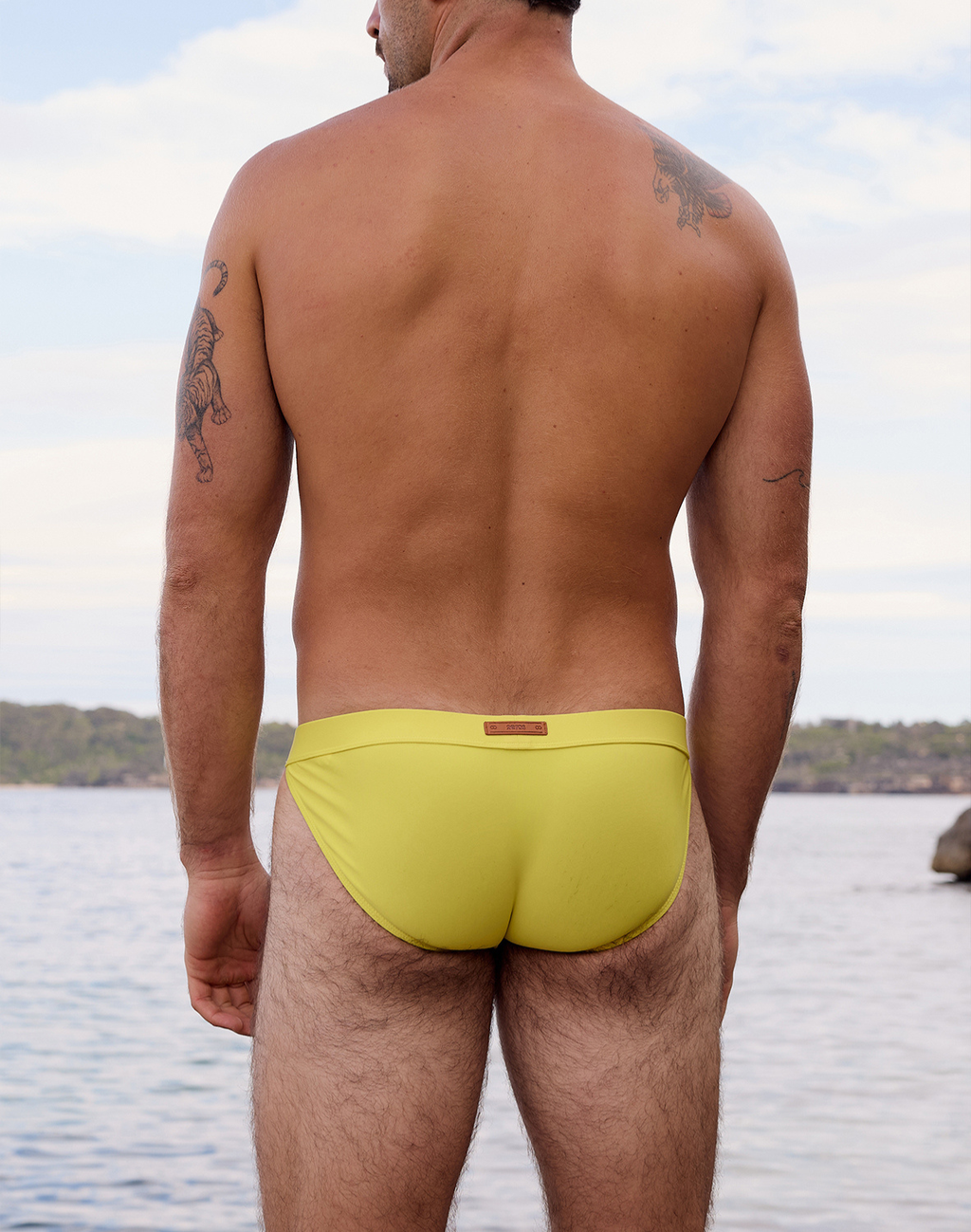 CityBOYZ USA 2Eros Encore Swim Tanga V50 in neon yellow, close-up of vibrant swim brief with sleek design and bright color.