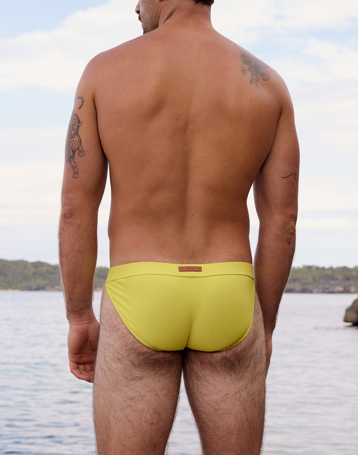 CityBOYZ USA 2Eros Encore Swim Tanga V50 in neon yellow, close-up of vibrant swim brief with sleek design and bright color.