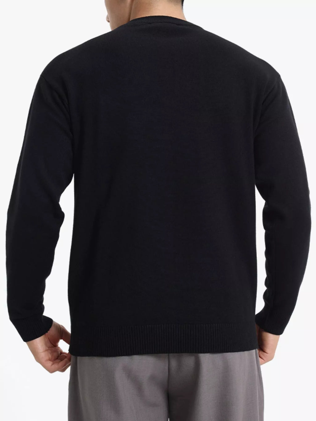 ValiantMan men's minimalist crew neck sweater with ribbed cuffs, in a neutral color, showcasing a close-up of the sweater's neckline and cuffs.