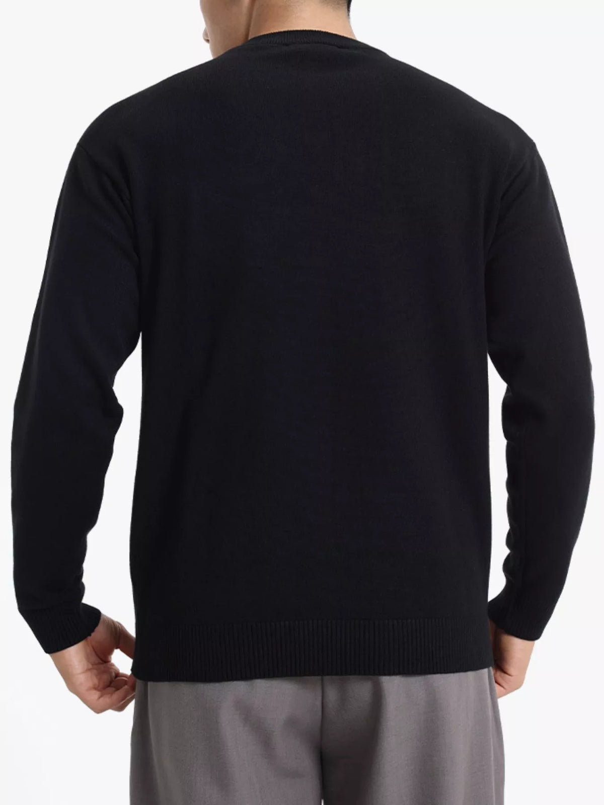 ValiantMan men's minimalist crew neck sweater with ribbed cuffs, in a neutral color, showcasing a close-up of the sweater's neckline and cuffs.