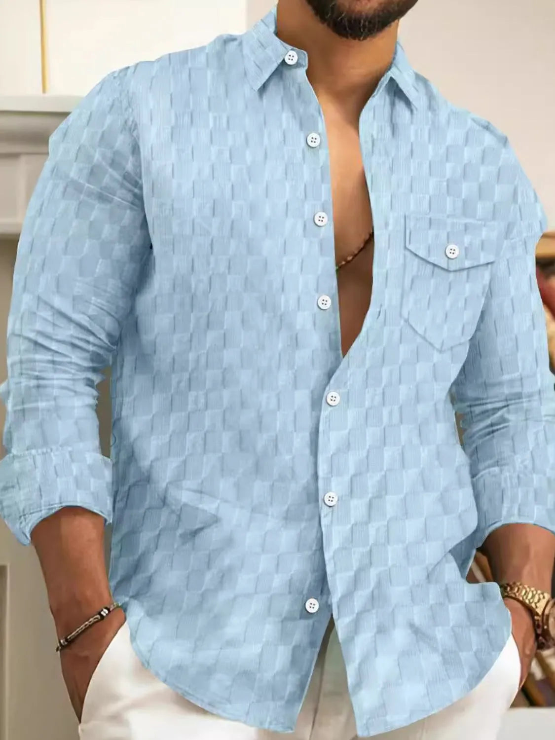 Men's full-size button-up long sleeve shirt by Trendsi, featuring a classic design and tailored fit, shown in the image.