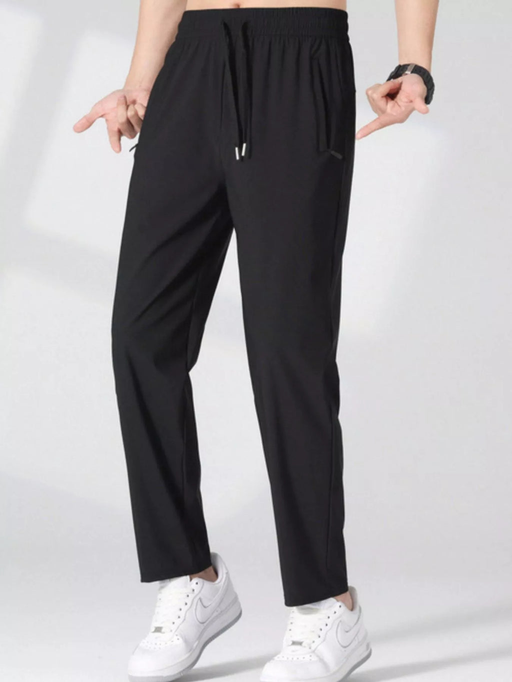 Plus size casual lightweight quick-dry pants for men by Trendsi, shown in a relaxed fit with breathable fabric and functional pockets.