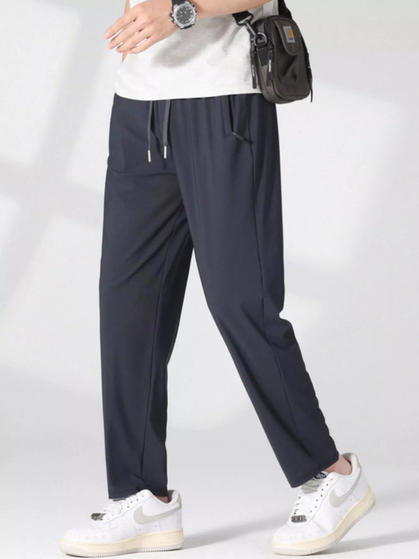 Plus size men's casual lightweight quick-dry pants by Trendsi, shown in a relaxed fit with breathable fabric and comfortable design.
