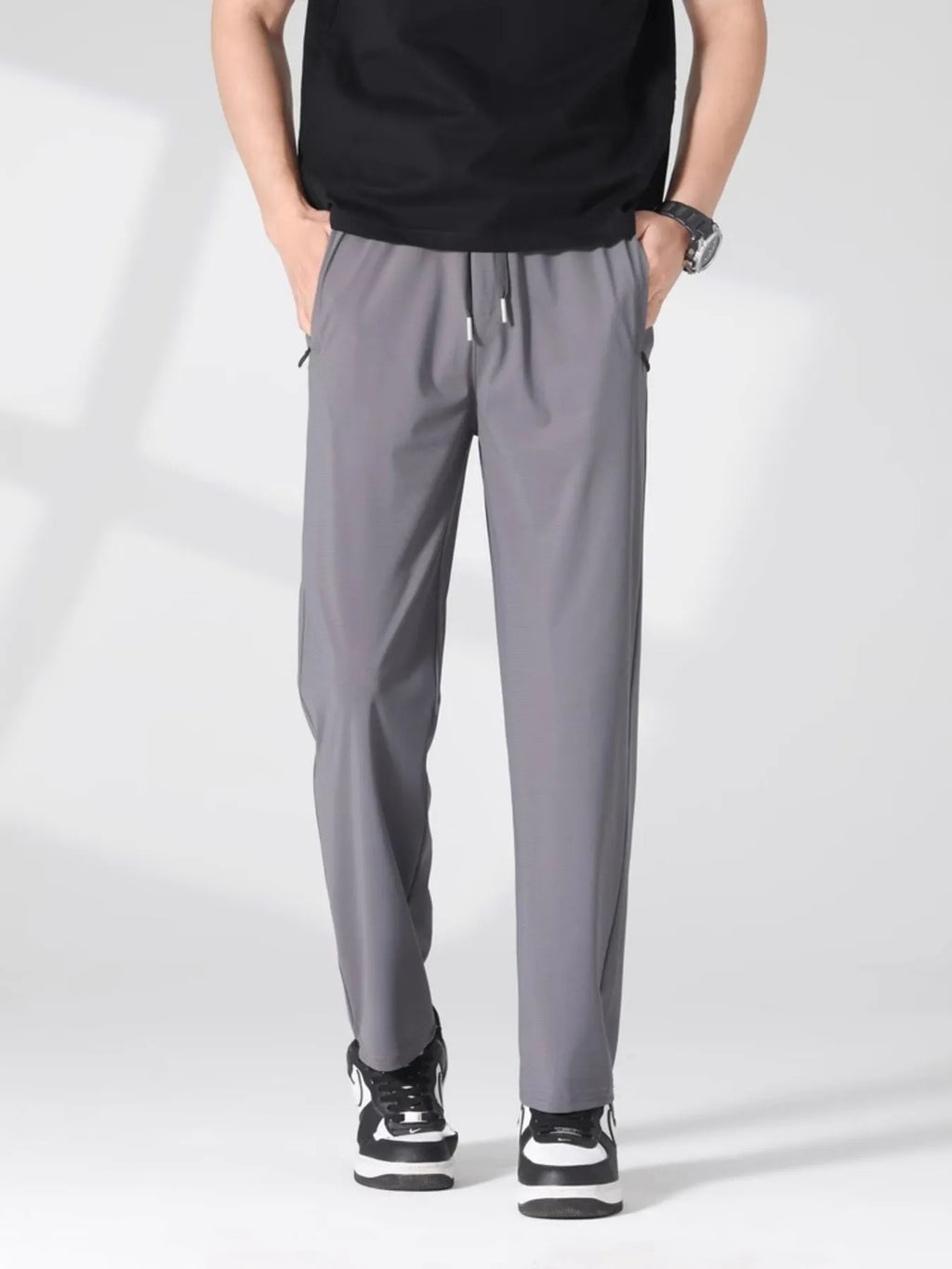 Plus size men's casual lightweight quick-dry pants by Trendsi, shown in a relaxed fit with breathable fabric and functional design.