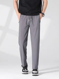 Plus size men's casual lightweight quick-dry pants by Trendsi, shown in a relaxed fit with breathable fabric and functional design.