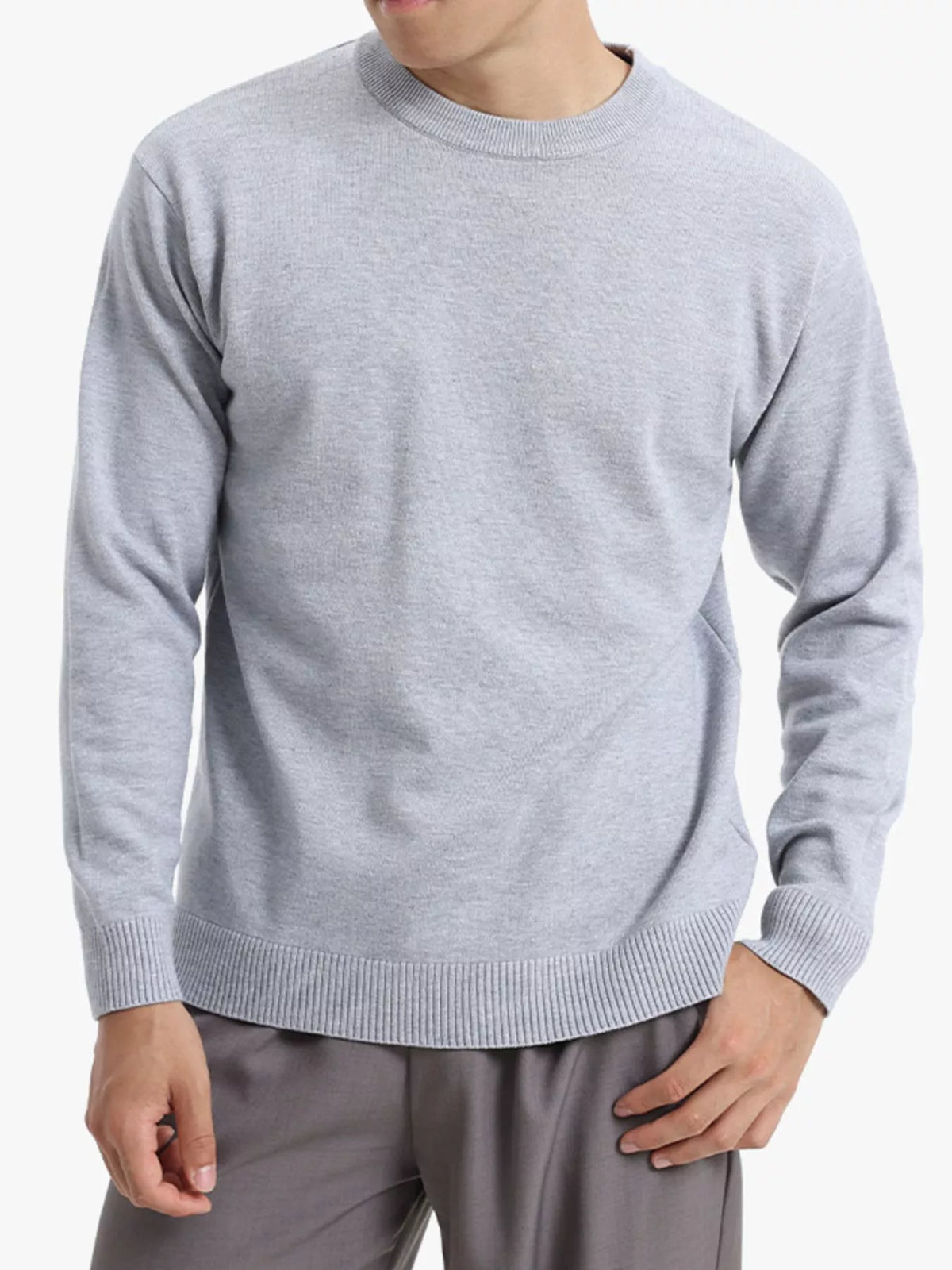 Trendsi ValiantMan men's minimalist crew neck sweater with ribbed cuffs in a soft, neutral fabric, showcasing a simple, stylish design.
