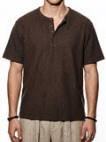 Men's short sleeve Henley T-shirt by Trendsi, in a soft fabric with a buttoned neckline and casual fit, shown in a neutral color.