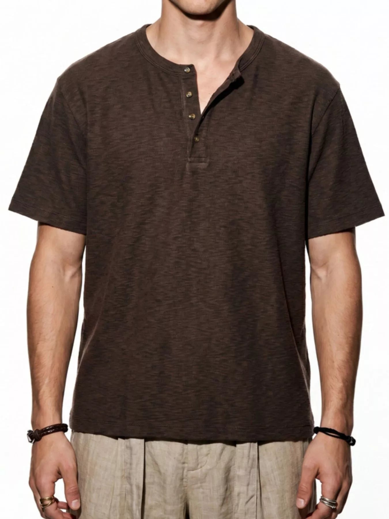 Men's short sleeve Henley T-shirt by Trendsi, in a soft fabric with a buttoned neckline and casual fit, shown in a neutral color.