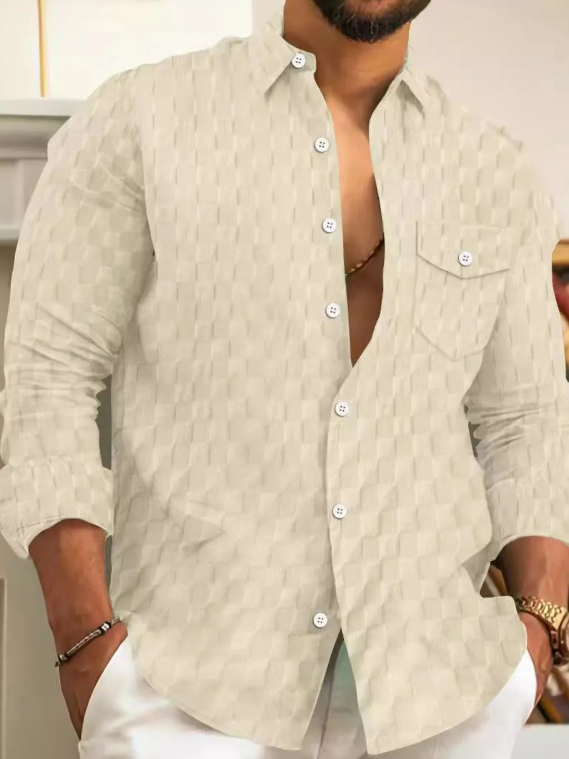 Men's full-size button-up long sleeve shirt by Trendsi, featuring a classic collar, button closure, and long sleeves in a stylish fabric