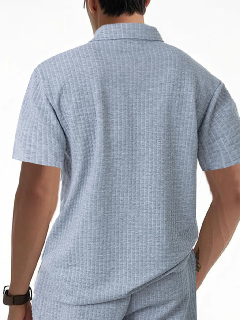 Men's waffle short sleeve polo shirt by Trendsi with zipper detail, featuring a stylish and casual design in neutral tones.