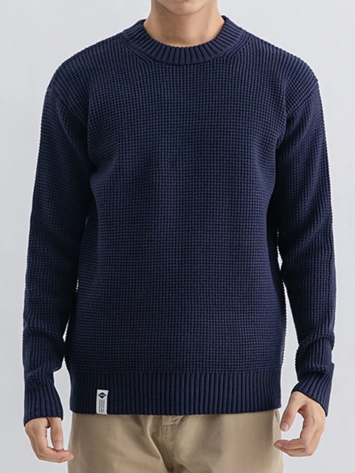 Men's plus size waffle knit crew neck sweater by Trendsi, featuring a cozy textured fabric in a comfortable fit.
