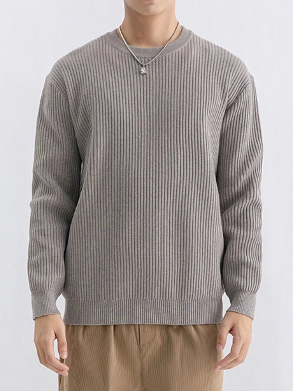 Plus size men's ribbed knit crew neck sweater by Trendsi, showing the navy blue sweater with textured ribbing and classic neckline.