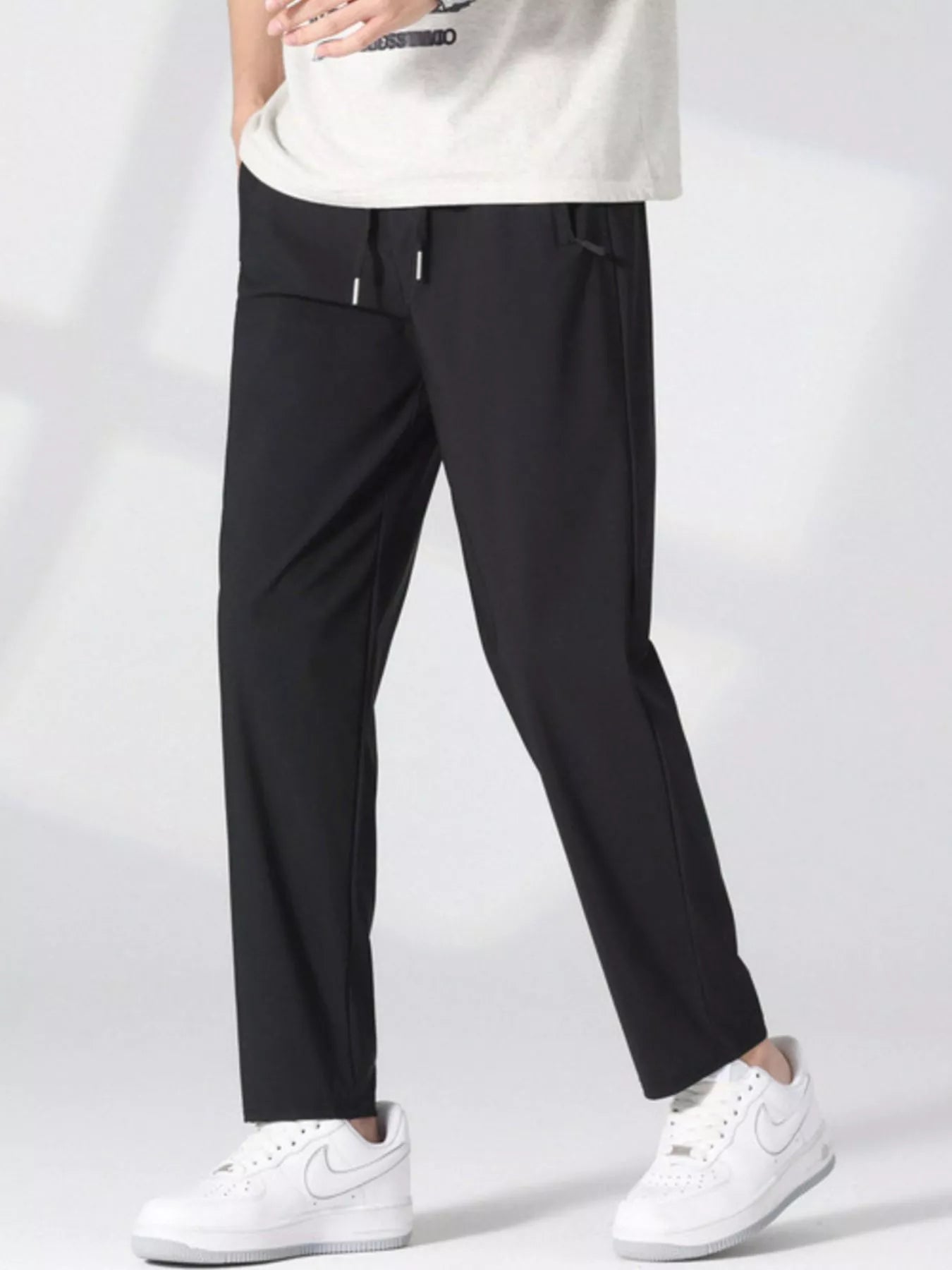 Plus size men's casual lightweight quick-dry pants by Trendsi, shown in a relaxed fit with breathable fabric and practical design.